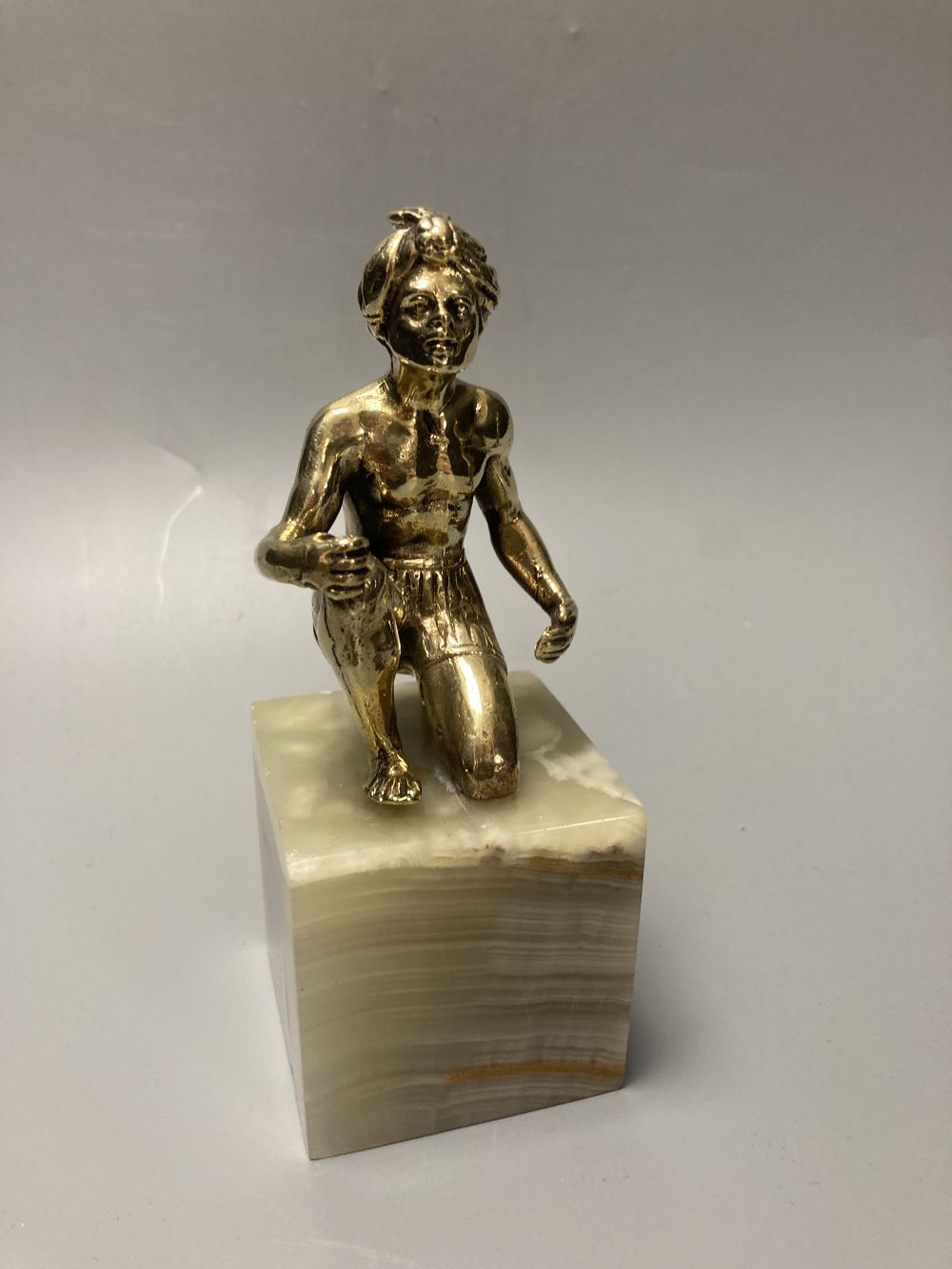 A silvered bronze figure of the Virgin and Mary, height 21cm and a similar tribal African seated gentleman